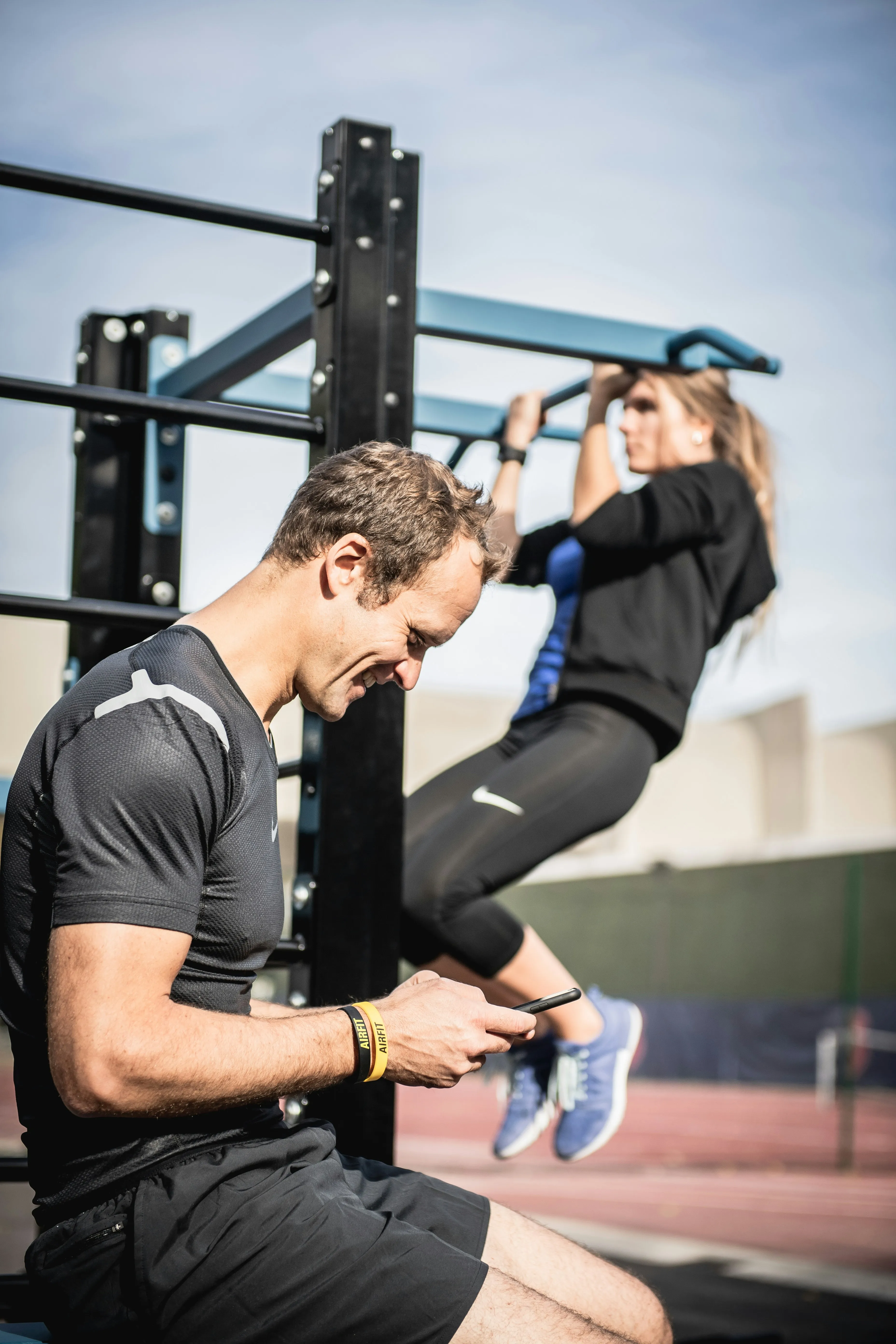 Couple working out together in outdoor gym